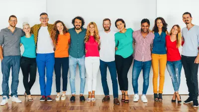 People in a row, smiling into the camera