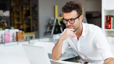 AI Consultant looks at the laptop screen