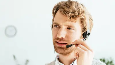 Technical support employee uses a tablet