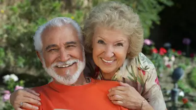 Elderly couple looking at the camera smiling