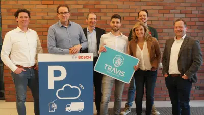 A group of people smile at the camera