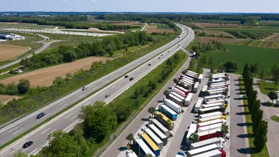 View of a truck parking lot on the edge of a freeway